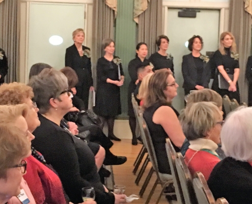 The WACquettes (standing) and Mark Burnell, Director